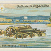 Hauling a gun across a river.