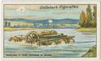 Hauling a gun across a river.