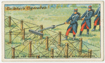 Rake for tearing down barbed wire entanglements.