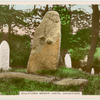 Sculptured menhir. Castel Churchyard.