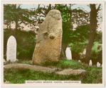 Sculptured menhir. Castel Churchyard.