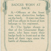 Badges worn at back.