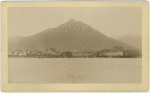 Alaskan seaside town with mountain in background