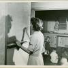 Woman writing on chalkboard