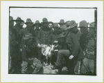 Group of soldiers gathered around a goat, Camp Black, Long Island, New York