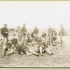 Group of soldiers sitting, rifles bound together, Camp Black, Long Island, New York