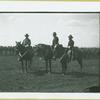 Three men mounted on horses in front of a group of soldiers, Camp Black, Long Island, New York