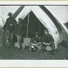 Soilders eating in front of a tent at Camp Black, Long Island, New York