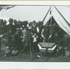 Group gathered around a man playing the dulcimer at Camp Black, Long Island, New York