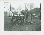 Men loading a cannon at Camp Townsend, New York