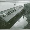 Overturned train car with broken windows