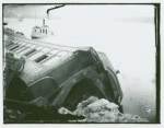 Overturned train car with broken windows