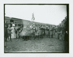 Men gathered at train station at Camp Black, Long Island, New York