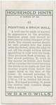 Pointing a brick wall.