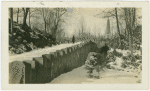 Man standing along stone wall