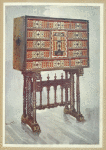 Vargueno cabinet of chestnut, ivory, etc., painted and gilt with wrought-iron and steel mounts: upon twisted, turned, and carved stand. Parnham collection.