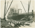Transferring lumber from a coast wise boat to the S.S. President Lincoln of the Dollar Steamship Co. headed for the Far East, from San Francisco