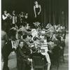 Helen Schneider (on table) and cast in the stage production Ghetto