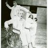 James Cahill (foreground), Christopher Reeve (background), Mary Elizabeth Mastrantonio (seated), and Caitlin Clarke (seated) in the stage production The Marriage of Figaro