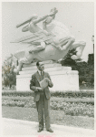 Anderson, James in front of statue