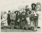 Women standing in front of United Airlines airplane