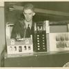 Aetna Exhibit - Miniature house on fire with man looking on