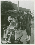 American Express Participation - Woman on cart in rain