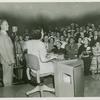 American Telephone & Telegraph Exhibit - Man and woman in front of crowd