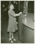 American Telephone & Telegraph Exhibit - Girl at display