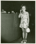 American Telephone & Telegraph Exhibit - Girl standing holding phone