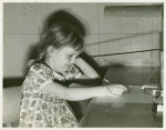 American Telephone & Telegraph Exhibit - Girl taking hearing test