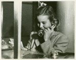 American Telephone & Telegraph Exhibit - Close-up of girl on phone