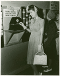 Amusements - American Jubilee - Performers - Eckhardt, Evelyn - Punching timecard (alternate format)