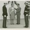 Amusements - American Jubilee - Performers - Wynn, Murray - Being presented Marine Insignia