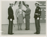 Amusements - American Jubilee - Performers - Wynn, Murray - Being presented Marine Insignia