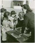 Amusements - American Jubilee - Scenes - School room, close-up of teachers and students