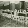 Amusements - Aquacade - Swimmers sitting on side of pool