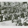 Amusements - Dance - Man dancing in street with band and audience