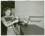 Amusements - Games and Rides - Woman shooting tommy gun