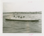 Amusements - Games and Rides - Miniature Boats - Man and woman in Queen Mary