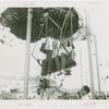 Amusements - Games and Rides - Parachute Jump - Man and woman on ride