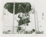 Amusements - Games and Rides - Parachute Jump - Man and woman on ride