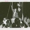 Amusements - Games and Rides - Parachute Jump - Man and woman suspended on jammed ride