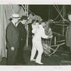 Amusements - Games and Rides - Parachute Jump - Grover Whalen watches employees work on chair