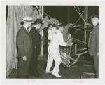 Amusements - Games and Rides - Parachute Jump - Grover Whalen watches employees work on chair