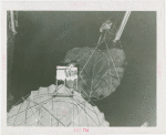 Amusements - Games and Rides - Parachute Jump - Two women suspended on jammed ride