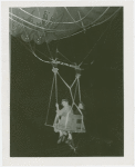Amusements - Games and Rides - Parachute Jump - Two women suspended on jammed ride