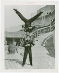 Amusements - Midway Activities - Two acrobats playing instruments