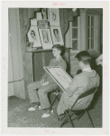 Amusements - Midway Activities - Artist drawing caricature of boy