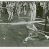 Amusements - Midway Activities - Girl at tug of war, sprayed by hose